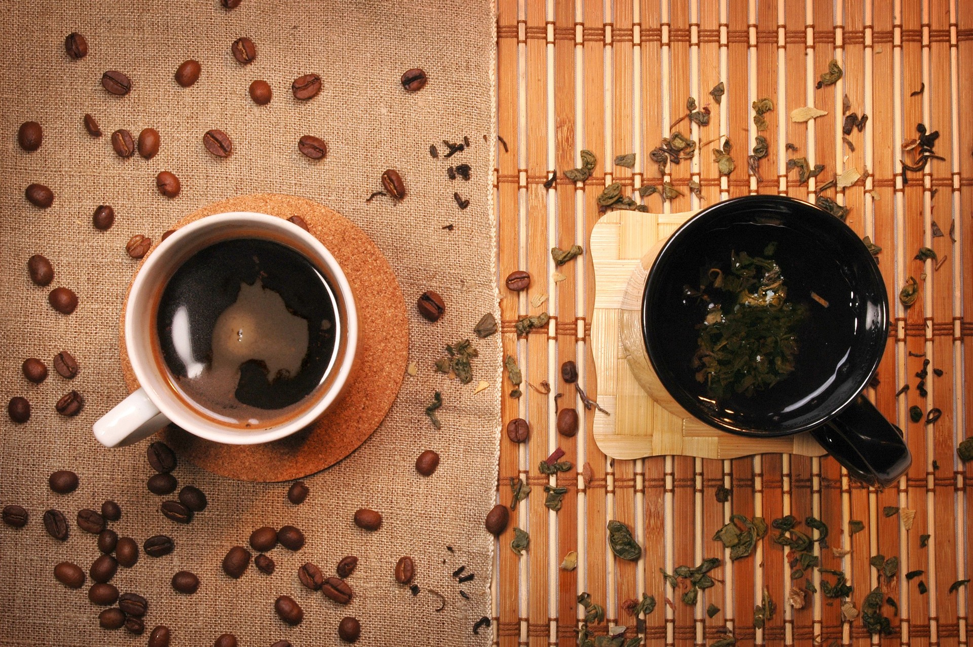 Two cups, one with tea and the other with coffee